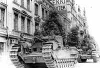 Танки MK IV «Черчиль» из состава 46-го гвардейского тяжелого танкового полка на улице Выборга, июнь 1944 г.
